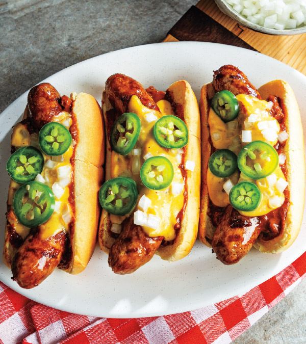 Chili, Beer-Cheese Sauce & Jalapeño-Topped Brats