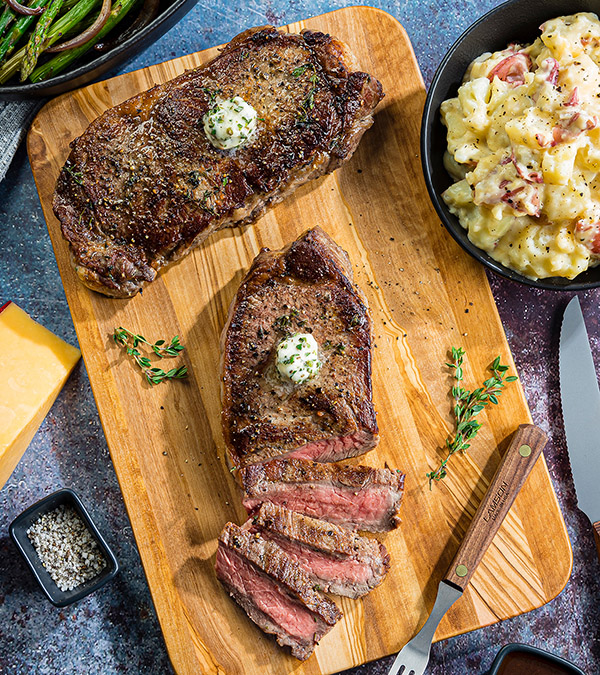 Pan-Roasted Strip Steaks with Gouda Smashed Redskins & Asparagus